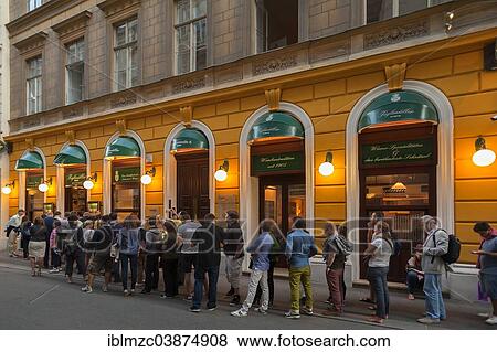 Stock Photo - "Tourists wait in long queues in front of the famous Schnitzel restaurant Figlmuller, Vienna, Vienna State, Austria, Europe". Fotosearch