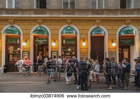 "Tourists wait in long queues in front of the famous Schnitzel restaurant Figlmuller, Vienna, Vienna State, Austria, Europe" View Large Photo Image Stock Photograph - "Tourists wait in long queues in front of the famous Schnitzel restaurant Figlmuller, Vienna, Vienna State, Austria, Europe". Fotosearch