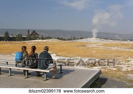 "Tourists waiting for the eruption of Old Faithful, Upper Geyser Basin, Yellowstone National Park, Wyoming, USA" View Large Photo Image Stock Photo - "Tourists waiting for the eruption of Old Faithful, Upper Geyser Basin, Yellowstone National Park, Wyoming, USA". Fotosearch