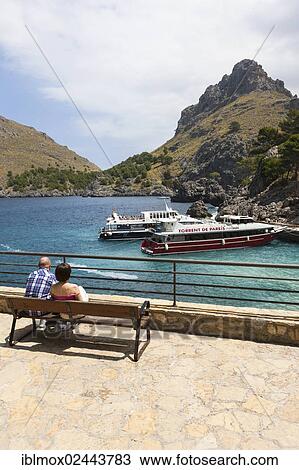 "Tourists watching the ferries in the Bay of Sa Calobra, Tramuntana Mountains, Majorca, Balearic Islands, Mediterranean Sea, Spain, Europe" View Large Photo Image Stock Image - "Tourists watching the ferries in the Bay of Sa Calobra, Tramuntana Mountains, Majorca, Balearic Islands, Mediterranean Sea, Spain, Europe". Fotosearch
