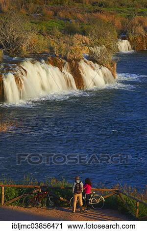 "Tourists watching waterfalls, Ruidera Lagoons, Lagunas de Ruidera Natural Park, Campo de Montiel, Spain, Europe" View Large Photo Image Stock Image - "Tourists watching waterfalls, Ruidera Lagoons, Lagunas de Ruidera Natural Park, Campo de Montiel, Spain, Europe". Fotosearch