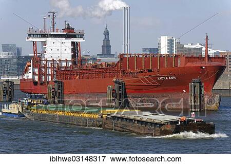 "Towboat and feeder vessel on the Norderelbe River, Hamburg, Hamburg, Hamburg, Germany, Europe" View Large Photo Image Stock Photo - "Towboat and feeder vessel on the Norderelbe River, Hamburg, Hamburg, Hamburg, Germany, Europe". Fotosearch