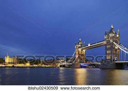 Stock Photo - "Tower Bridge with the towers of the Tower of London on the left, at dusk, London, England, United Kingdom, Europe". Fotosearch