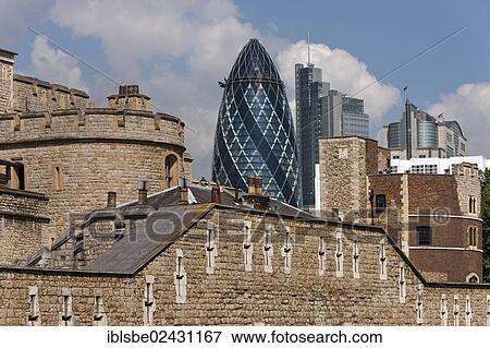 Stock Photo - "Tower of London in front of the Swiss Re Tower, The Gherkin, London, England, United Kingdom, Europe". Fotosearch