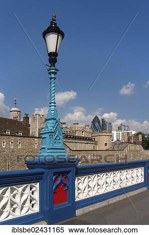 Stock Photography - "Tower of London, railing with a lantern in front of the Swiss Re Tower, The Gherkin, London, England, United Kingdom, Europe". Fotosearch