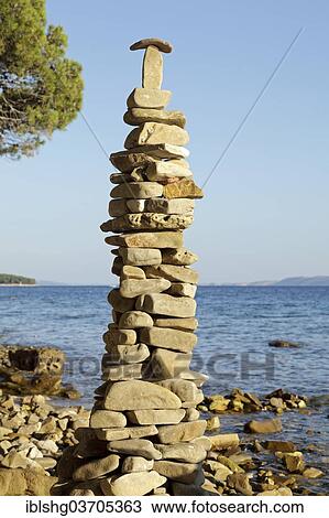 "Tower of rocks or cairn on the beach, Rab, Rab, Primorje-Gorski Kotar, Croatia, Europe" View Large Photo Image Stock Image - "Tower of rocks or cairn on the beach, Rab, Rab, Primorje-Gorski Kotar, Croatia, Europe". Fotosearch