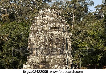 Stock Photo - Tower with a face carved in stone, Bayon Temple, Angkor Thom, Siem Reap, Cambodia, Southeast Asia, Asia. Fotosearch