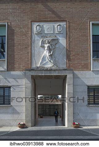 Stock Photo - "Town Hall, portal with a relief of the goddess of victory, Italian Rationalism, Sabaudia, Lazio, Italy, Europe". Fotosearch