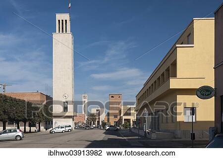 Stock Image - "Town Hall tower, towers of the party headquarters and the church at the back, monumental architecture, Italian Rationalism, Sabaudia, Lazio, Italy, Europe". Fotosearch