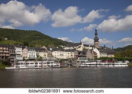 Stock Image - "Town view with Moselle river and Catholic parish church of St. Martin, Cochem, Moselle, Rhineland-Palatinate, Germany, Europe, PublicGround, Europe". Fotosearch