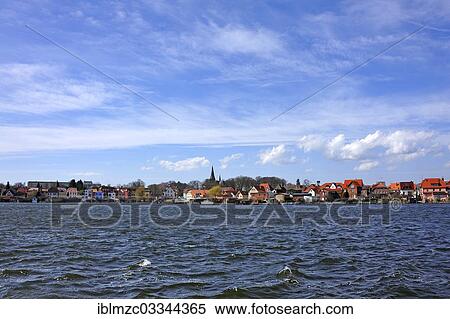Stock Photography - "Townscape of the island town of Malchow and Malchow Lake, seen from the monastery, Malchow, Mecklenburg-Western Pomerania, Germany, Europe". Fotosearch