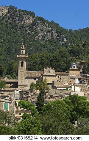 Picture - "Townscape with the Charterhouse or Royal Carthusian Monastery of Valldemossa, Valldemossa, Majorca, Balearic Islands, Spain, Europe". Fotosearch