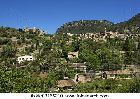 Stock Image - "Townscape with the Charterhouse or Royal Carthusian Monastery of Valldemossa, Valldemossa, Majorca, Balearic Islands, Spain, Europe". Fotosearch