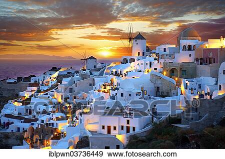 Stock Photo - "Townscape with windmills at sunset, Oia, Santorini, Cyclades, Greece, Europe". Fotosearch