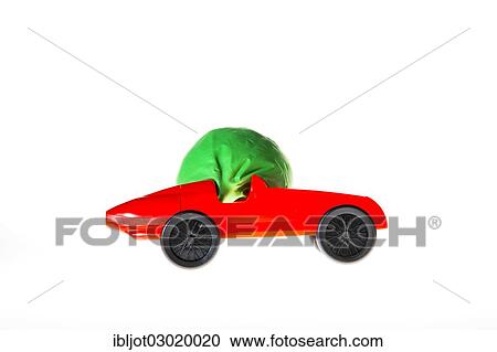 "Toy car with a """"balloon-drive"""", the air escaping from the balloon propels the car forward, symbolic image for alternative energies, technologies" View Large Photo Image Stock Image - "Toy car with a """"balloon-drive"""", the air escaping from the balloon propels the car forward, symbolic image for alternative energies, technologies". Fotosearch