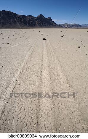 Picture - "Tracks created by the mysterious moving rocks at the """"Racetrack"""", a dry lakebed or playa, Death Valley, Death Valley National Park, California, USA". Fotosearch