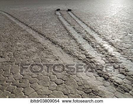 Picture - "Tracks created by the mysterious moving rocks at the """"Racetrack"""", a dry lakebed or playa, Death Valley, Death Valley National Park, California, USA". Fotosearch