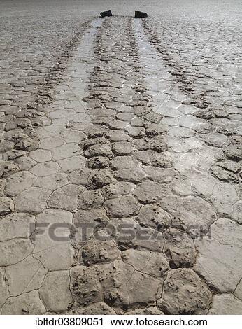 "Tracks created by the mysterious moving rocks at the """"Racetrack"""", a dry lakebed or playa, Death Valley, Death Valley National Park, California, USA" View Large Photo Image Stock Image - "Tracks created by the mysterious moving rocks at the """"Racetrack"""", a dry lakebed or playa, Death Valley, Death Valley National Park, California, USA". Fotosearch
