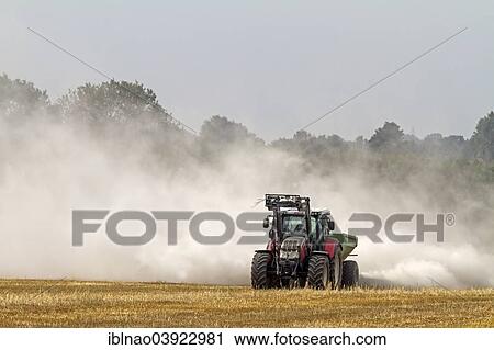 "Tractor liming a field, Schleswig-Holstein, Germany, Europe" View Large Photo Image Stock Image - "Tractor liming a field, Schleswig-Holstein, Germany, Europe". Fotosearch
