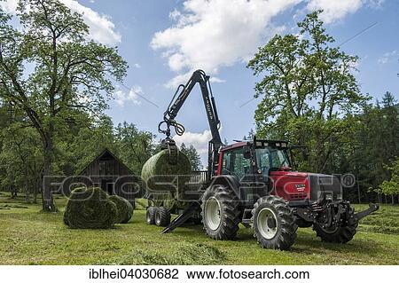 "Tractor making hay, hay harvest, Upper Austria, Austria, Europe" View Large Photo Image Stock Image - "Tractor making hay, hay harvest, Upper Austria, Austria, Europe". Fotosearch