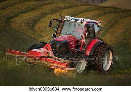 "Tractor mowing hay, Soll, Kufstein District, North Tirol, Tirol, Austria, Europe" View Large Photo Image Picture - "Tractor mowing hay, Soll, Kufstein District, North Tirol, Tirol, Austria, Europe". Fotosearch