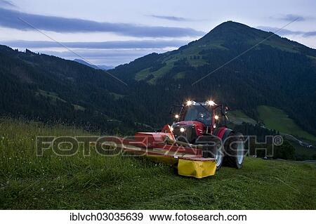 "Tractor mowing hay, Soll, Kufstein District, North Tirol, Tirol, Austria, Europe" View Large Photo Image Stock Photo - "Tractor mowing hay, Soll, Kufstein District, North Tirol, Tirol, Austria, Europe". Fotosearch