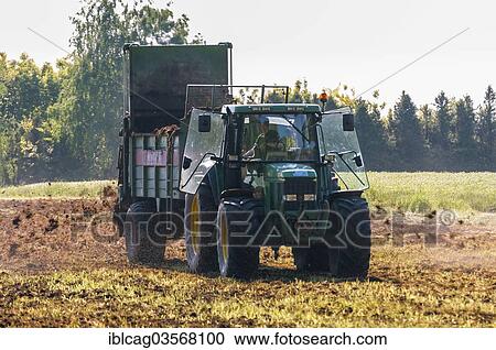 "Tractor with manure spreader, farmer working in the fields, spreading manure, Gotzenhain, Dreieich, Hesse, Germany, Europe" View Large Photo Image Stock Image - "Tractor with manure spreader, farmer working in the fields, spreading manure, Gotzenhain, Dreieich, Hesse, Germany, Europe". Fotosearch
