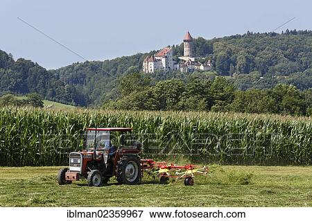 "Tractor with tedder in front of Burg Clam Castle, Klam, Muehlviertel region, Upper Austria, Austria, Europe, PublicGround, Europe" View Large Photo Image Stock Photo - "Tractor with tedder in front of Burg Clam Castle, Klam, Muehlviertel region, Upper Austria, Austria, Europe, PublicGround, Europe". Fotosearch