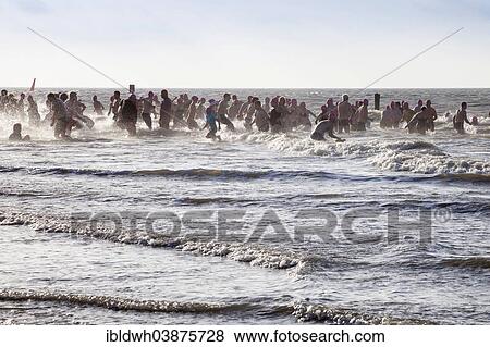 "Traditional """"Anbaden"""", the first dip of the year in the sea on 1st January on Weststrand beach, Norderney, East Frisian Islands, East Frisia, Lower Saxony, Germany, Europe" View Large Photo Image Stock Photo - "Traditional """"Anbaden"""", the first dip of the year in the sea on 1st January on Weststrand beach, Norderney, East Frisian Islands, East Frisia, Lower Saxony, Germany, Europe". Fotosearch