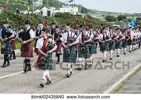 "Traditional bagpipe parade, Helmsdale Highland Games, Helmsdale, Sutherland, Scotland, United Kingdom, Europe" View Large Photo Image Stock Image - "Traditional bagpipe parade, Helmsdale Highland Games, Helmsdale, Sutherland, Scotland, United Kingdom, Europe". Fotosearch