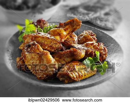 Stock Photograph - Traditional barbecue chicken wings. Fotosearch