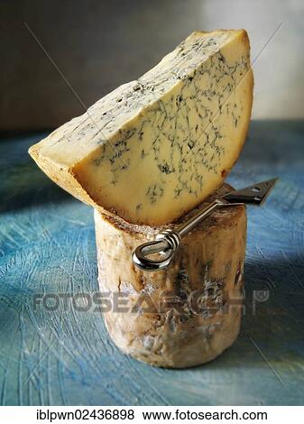 Traditional British blue Stilton cheese truckle View Large Photo Image Stock Photo - Traditional British blue Stilton cheese truckle. Fotosearch