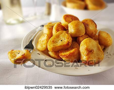 Traditional British roast potatoes View Large Photo Image Stock Photography - Traditional British roast potatoes. Fotosearch