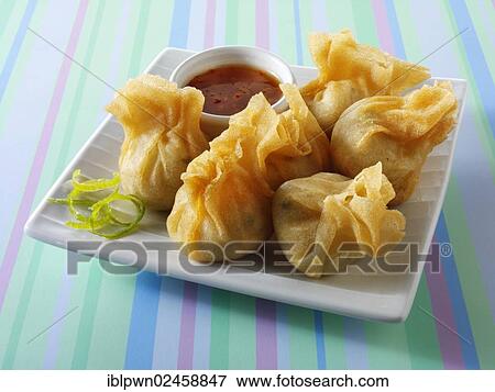 Traditional Chinese dim sum with a chilli dipping sauce View Large Photo Image Stock Photo - Traditional Chinese dim sum with a chilli dipping sauce. Fotosearch