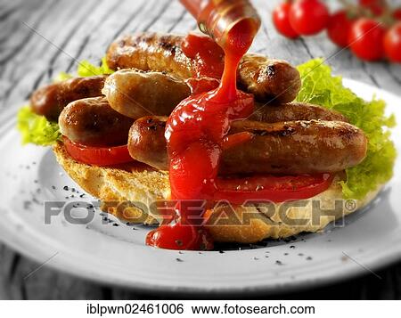 Traditional chipolata pork sausages with tomato ketchup sandwich View Large Photo Image Stock Photograph - Traditional chipolata pork sausages with tomato ketchup sandwich. Fotosearch