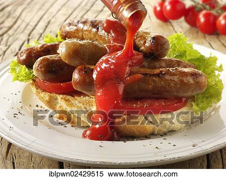 Traditional chipolata pork sausages with tomato ketchup sandwich View Large Photo Image Stock Photography - Traditional chipolata pork sausages with tomato ketchup sandwich. Fotosearch