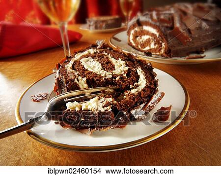 Traditional chocolate Swiss roll or log View Large Photo Image Picture - Traditional chocolate Swiss roll or log. Fotosearch