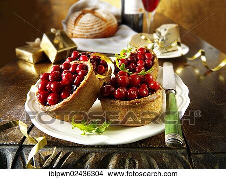 Traditional cranberry topped pork pies View Large Photo Image Picture - Traditional cranberry topped pork pies. Fotosearch