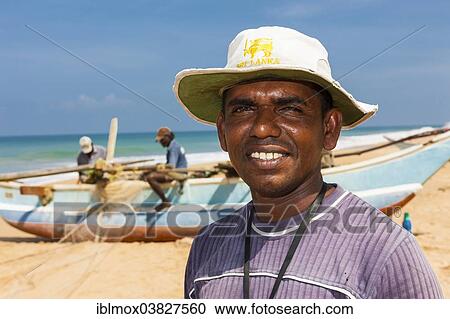 "Traditional fishermen with an outrigger boat on the beach, near Duwemodara Galle Region, Southern Province, Sri Lanka, Asia" View Large Photo Image Stock Image - "Traditional fishermen with an outrigger boat on the beach, near Duwemodara Galle Region, Southern Province, Sri Lanka, Asia". Fotosearch