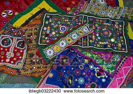 Stock Image - "Traditional needlework from Gujarat, embroidery with small sewn-on mirrors, patchwork sewing, Rann of Kutch, Gujarat, India, Asia". Fotosearch