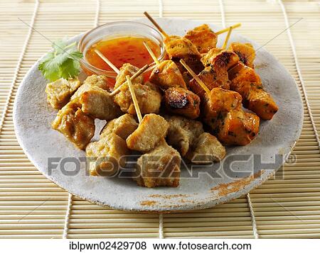 Traditional oriental satay with chilli dipping sauce View Large Photo Image Stock Photo - Traditional oriental satay with chilli dipping sauce. Fotosearch