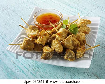 Traditional Oriental satay with chilli dipping sauce View Large Photo Image Stock Photography - Traditional Oriental satay with chilli dipping sauce. Fotosearch