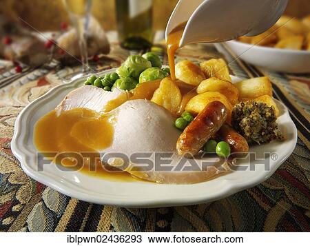 Stock Image - Traditional roast turkey dinner. Fotosearch