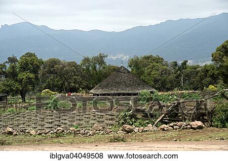 Stock Photo - "Traditional round built Bale-house surrounded by a braided bamboo fence, near Rira, Bale Mountains, Oromia Region, Ethiopia, Africa". Fotosearch