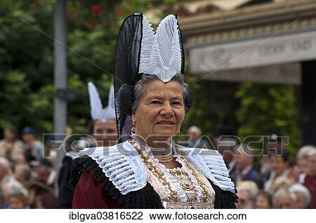 Stock Image - "Traditional Swiss costume, woman wearing the traditional Uri Sunday costume with a Frauenchappli headdress as the status symbol of married women, Trachtenfest Interlaken costume festival, Switzerland, Europe". Fotosearch