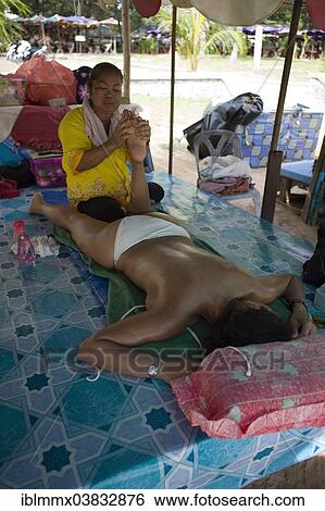 "Traditional Thai massage at a beach, Khao Lak, Thailand, Asia" View Large Photo Image Stock Photograph - "Traditional Thai massage at a beach, Khao Lak, Thailand, Asia". Fotosearch