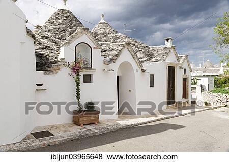 "Traditional Trulli or round houses, Rione Aia Piccola, Alberobello, Valle d'Itria, Trulli valley, Apulia, Italy, Europe" View Large Photo Image Stock Photo - "Traditional Trulli or round houses, Rione Aia Piccola, Alberobello, Valle d'Itria, Trulli valley, Apulia, Italy, Europe". Fotosearch