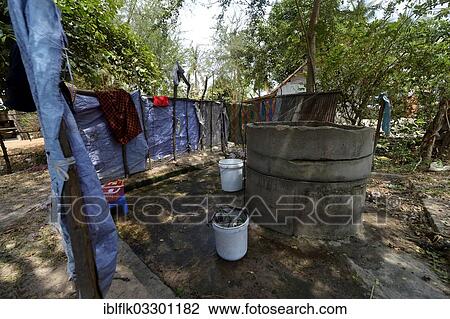 Stock Image - "Traditional washing facilities in a village, Tropeng Village, Bathi District, Takeo Province, Cambodia, Asia". Fotosearch
