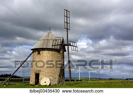 "Traditional windmill, wind turbines of the Ally Mercoeur Wind Farm at the back, near Ally, Haute-Loire department, Auvergne, France, Europe" View Large Photo Image Stock Image - "Traditional windmill, wind turbines of the Ally Mercoeur Wind Farm at the back, near Ally, Haute-Loire department, Auvergne, France, Europe". Fotosearch