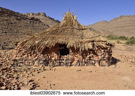 Stock Photography - "Traditional Zeriba at Idaran, temporarily used Tuareg village in Idaran Canyon, Iherir, Tassili n'Ajjer National Park, Unesco World Heritage Site, Sahara desert, Algeria, Africa". Fotosearch